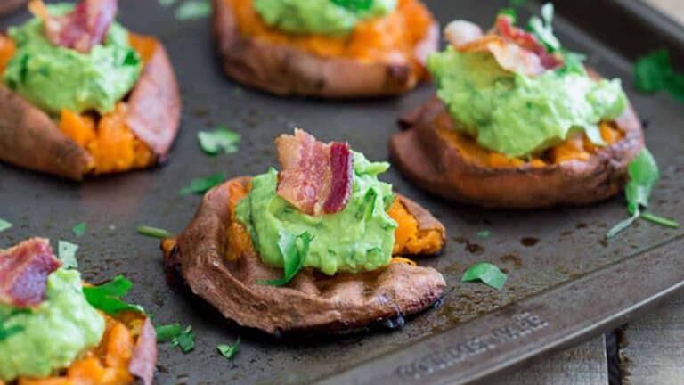 Sweet potato stuffed with guacamole and bacon.