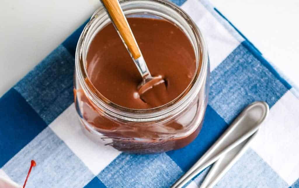 Top view of a mason jar full of hot fudge sauce..