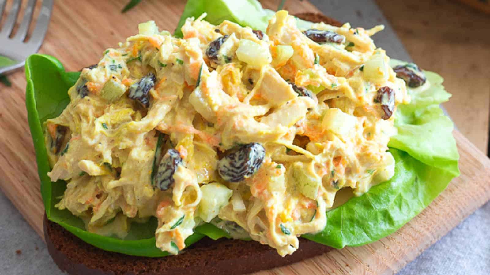 Turmeric chicken salad on a slice of bread.