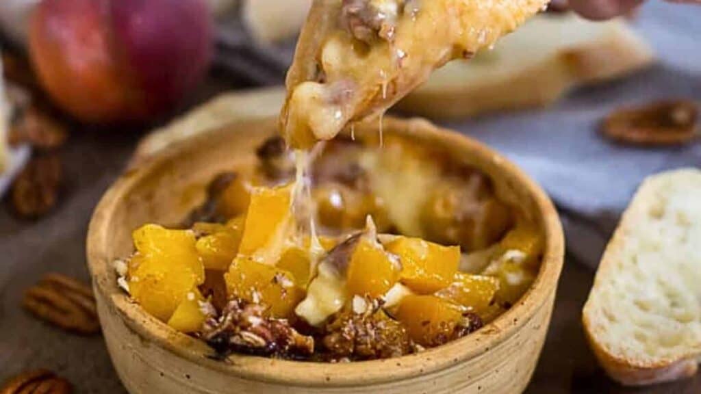 In just seconds, a person is dipping a piece of bread into a bowl of peach and pecan dip from one of the 39 quick recipes available.