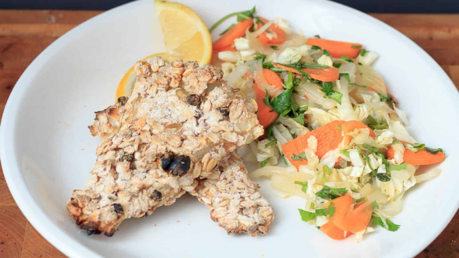 A plate with a piece of bread and a salad.