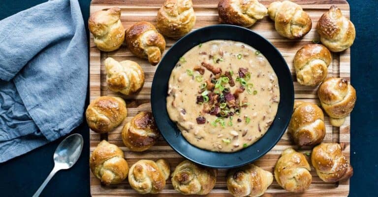 A bowl of food on a cutting board.