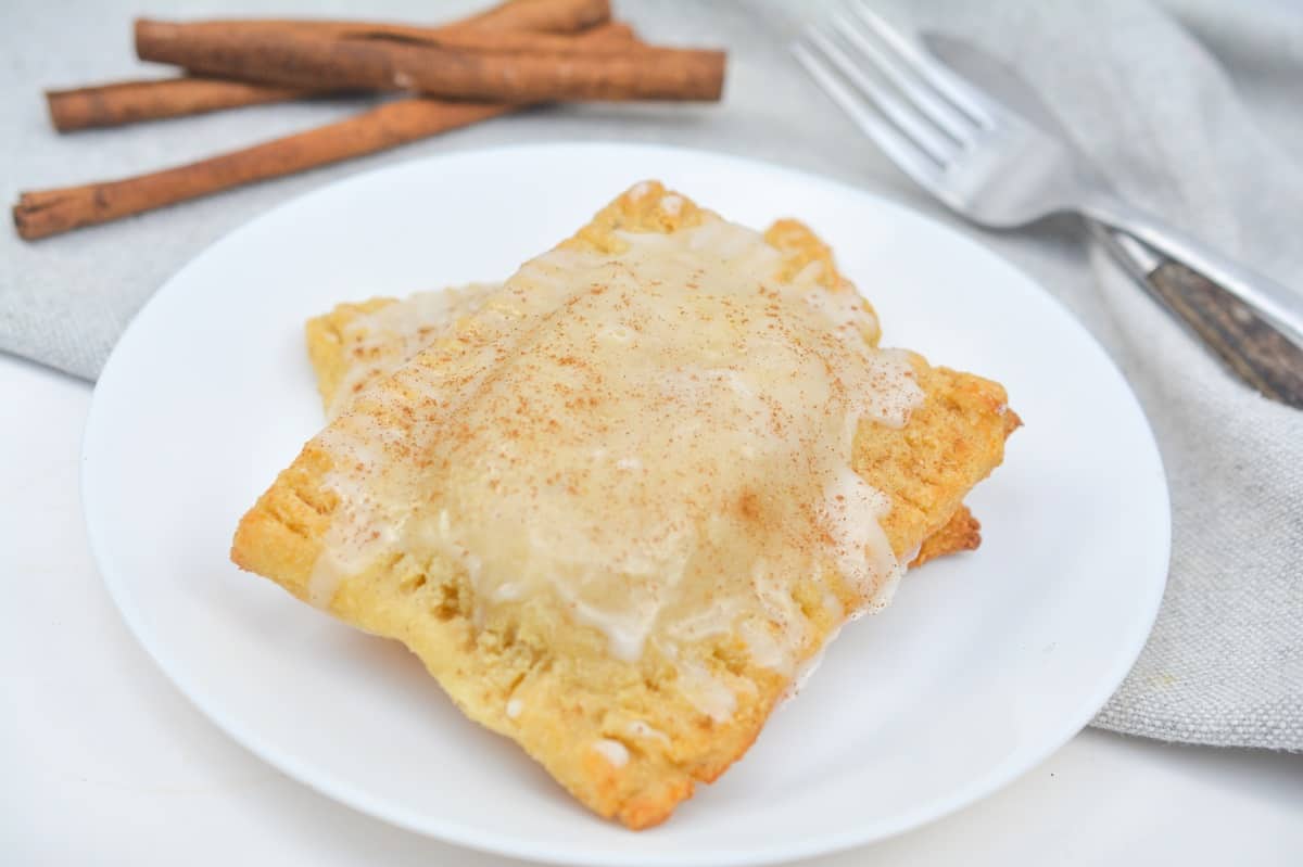 A plate with cinnamon and sugar pastries on it.