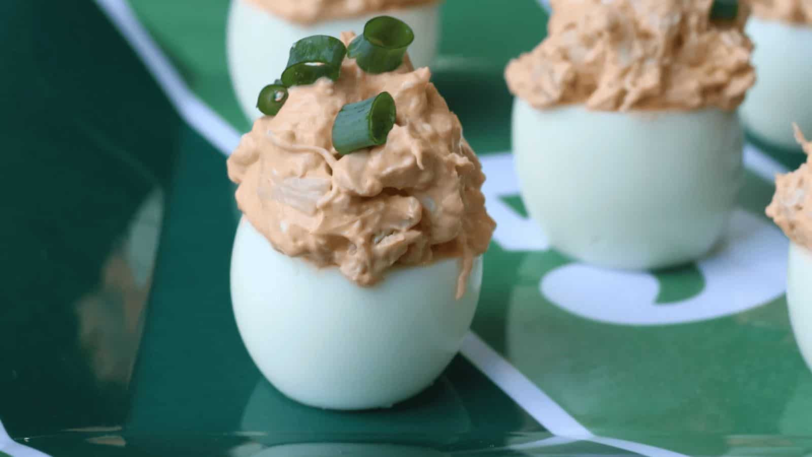 Football themed green plate with deviled eggs.