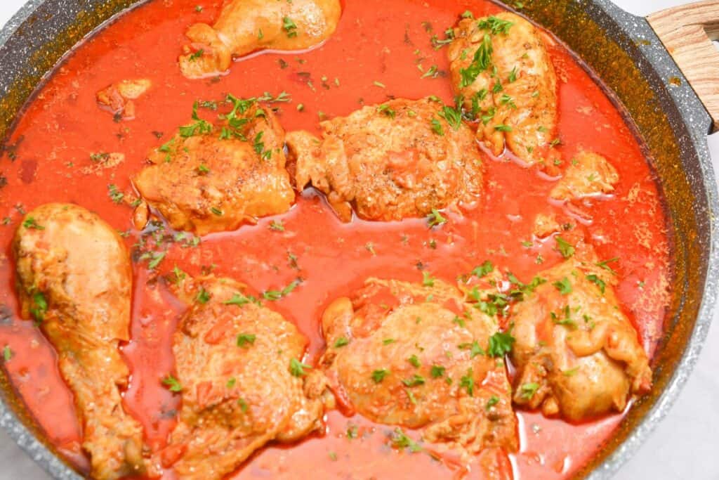 One-skillet chicken in rich red sauce.
