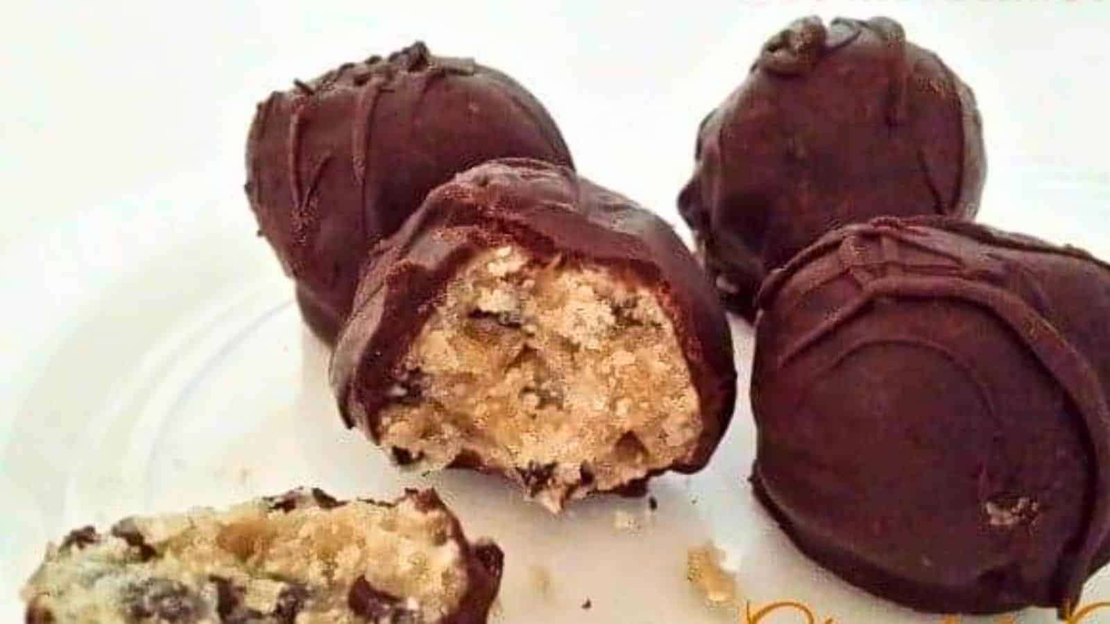 Image shows Chocolate chip cookie dough truffles on a white plate.