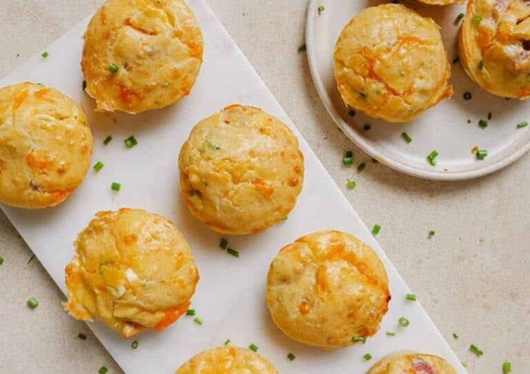 Cottage cheese breakfast muffins on a white plate and white platter.