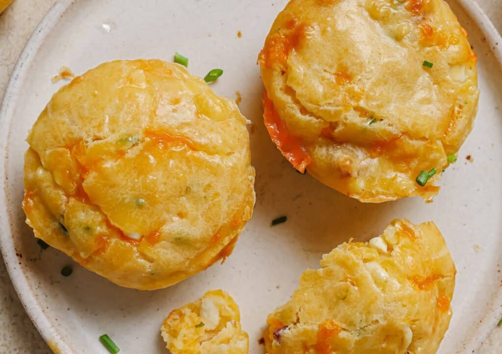 Cottage cheese breakfast muffins on a white plate.