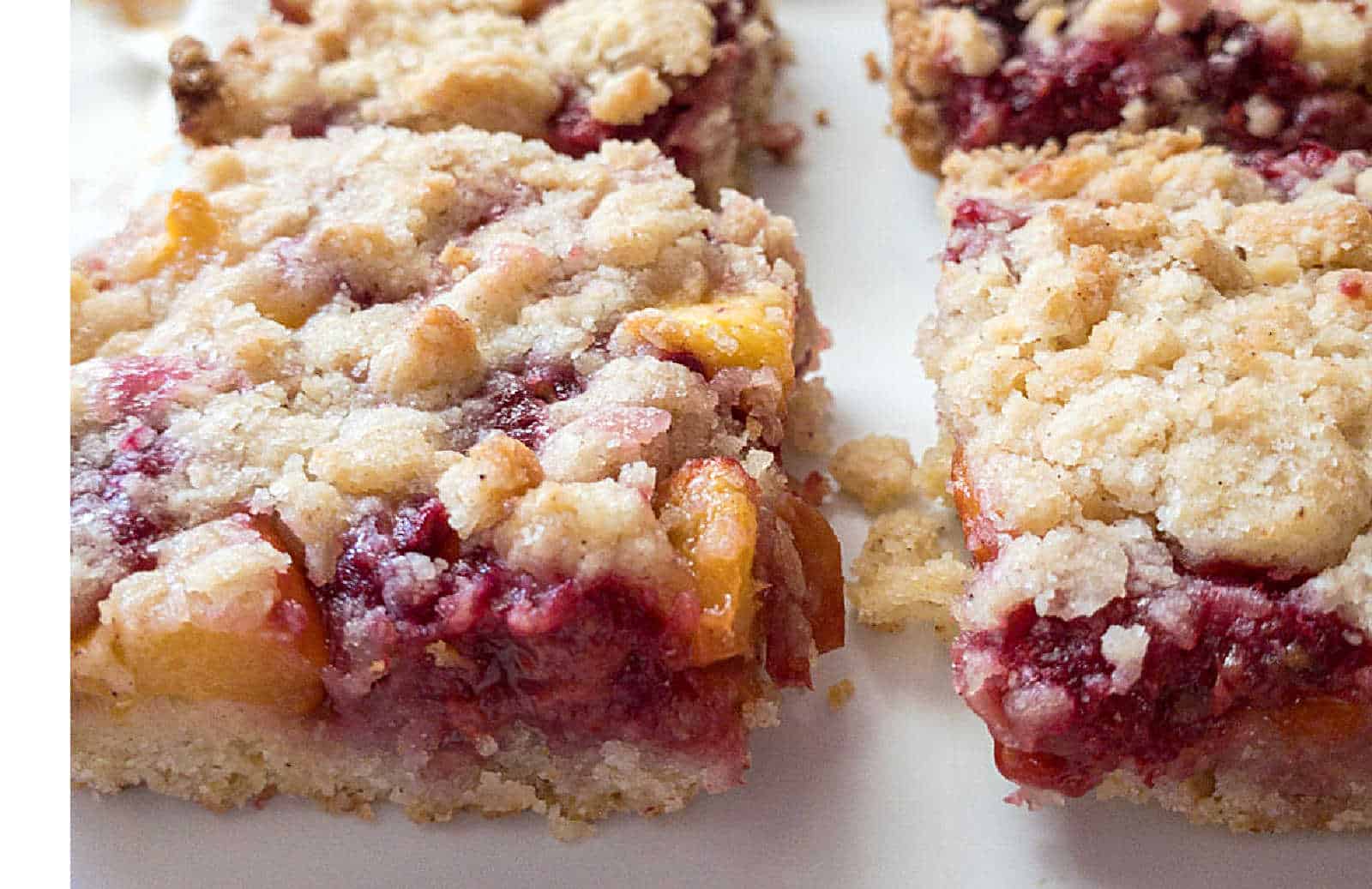 Peach raspberry bar cookies cut into squares.