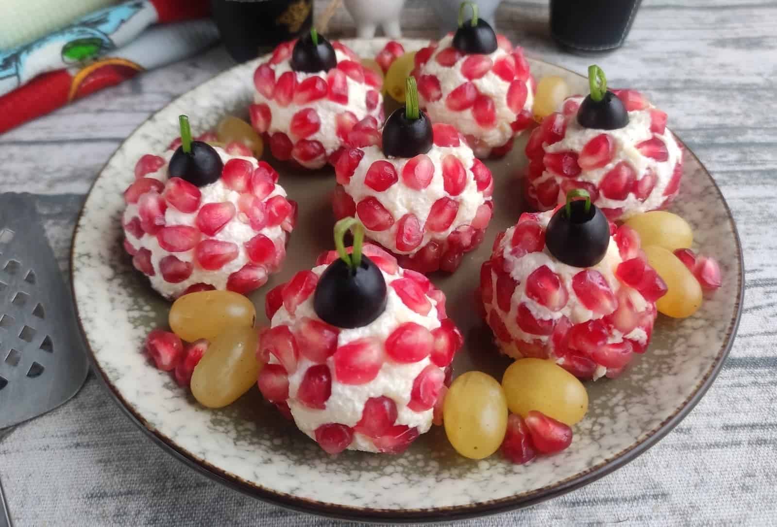 Pomegranate balls on a plate.