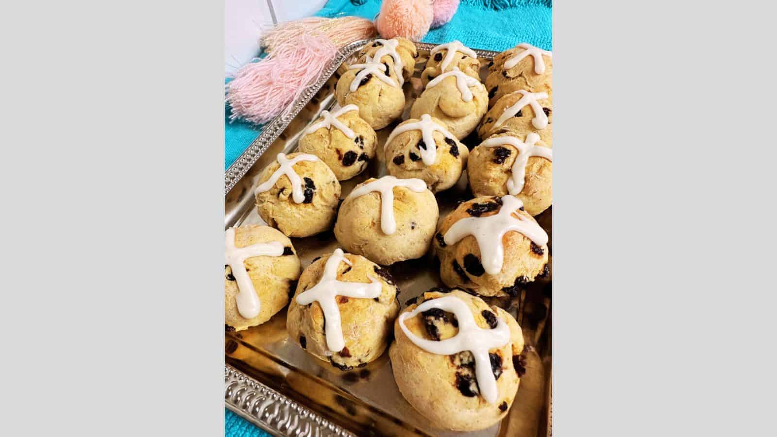 Hot cross buns on silver tray.