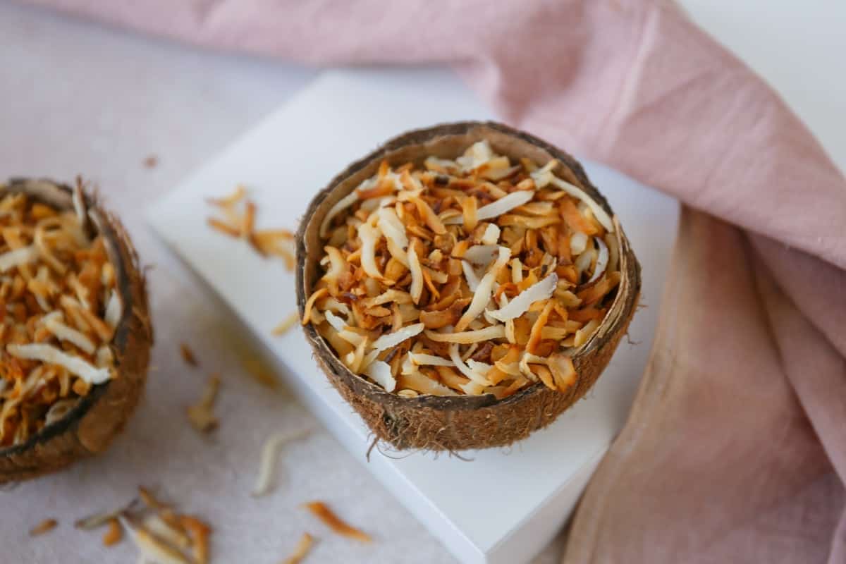 Coconut candy in coconut shell.