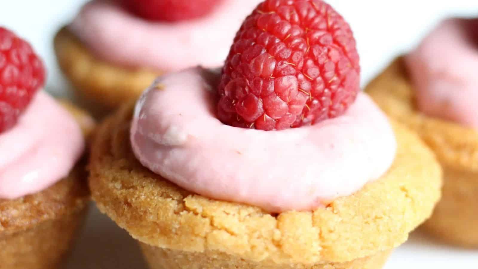 Up close shot of raspberry cheesecake cookie cups.