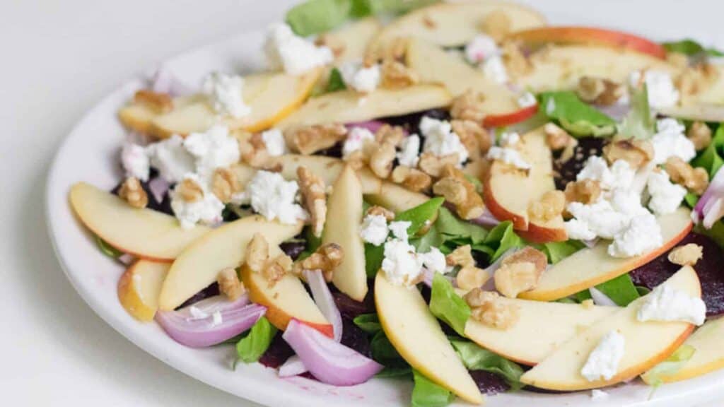 A healthy and flavorful salad recipe featuring the delicious combination of apples, walnuts, and feta cheese.