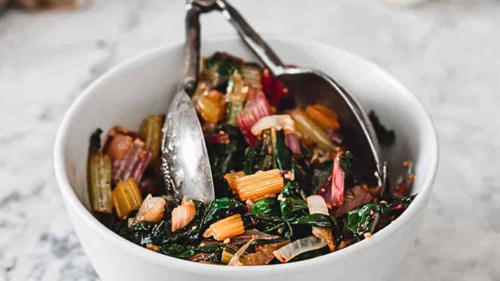 39 quick recipes featuring a bowl of greens with spoons in it.