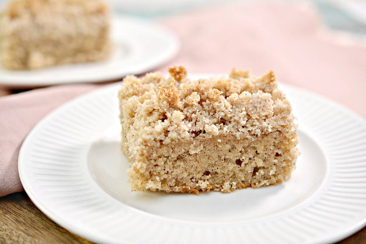 A piece of coffee cake on a plate.
