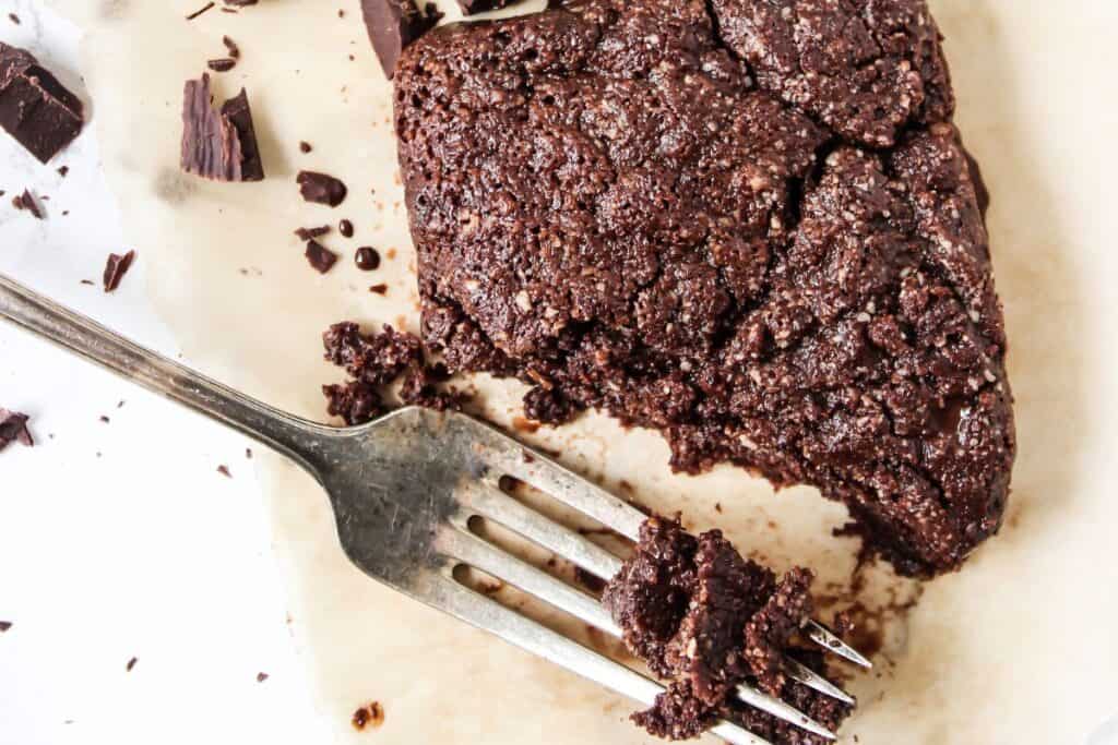 A piece of chocolate cake with a fork.