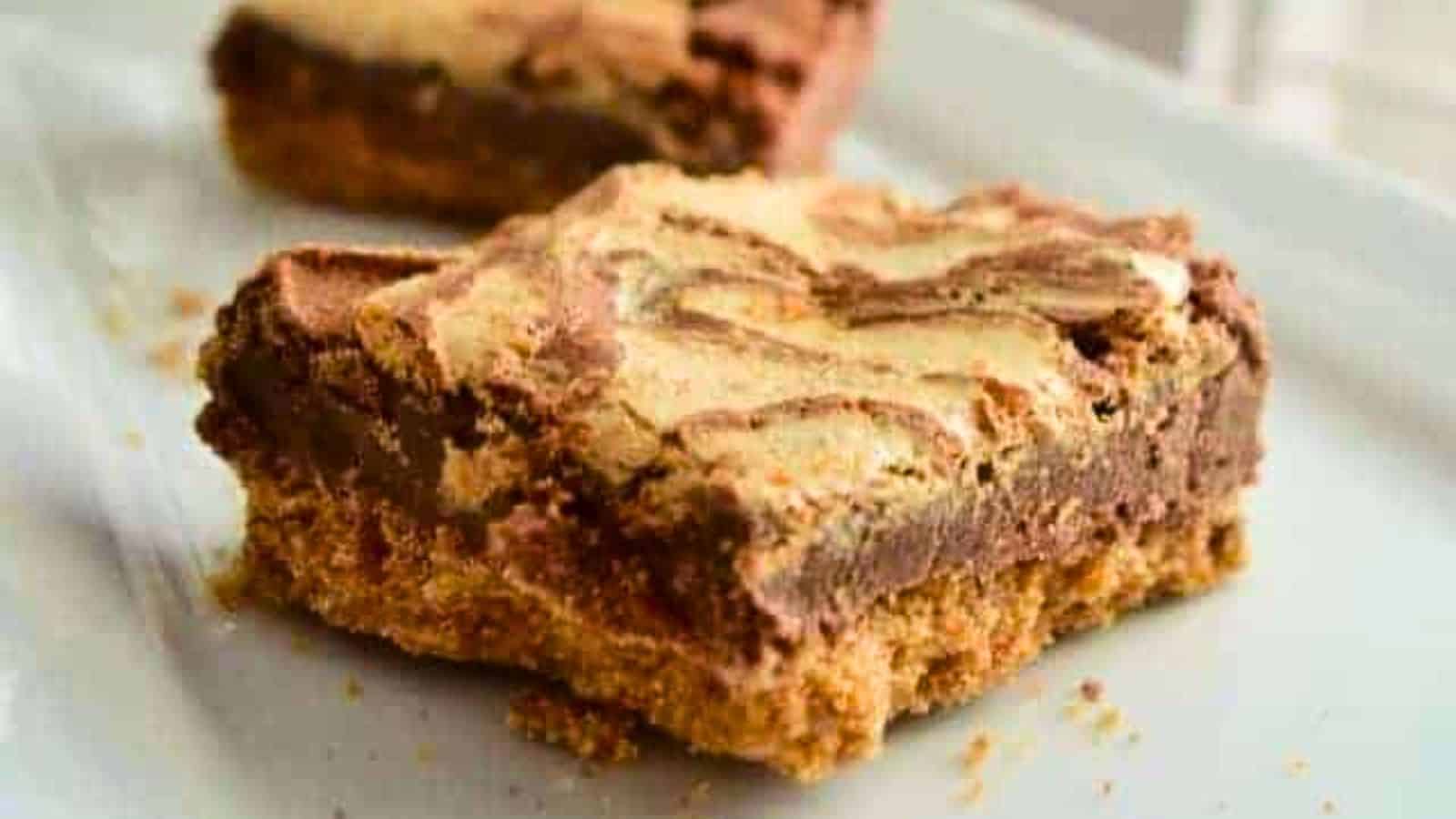 Image shows Smores brownies on a white tray.