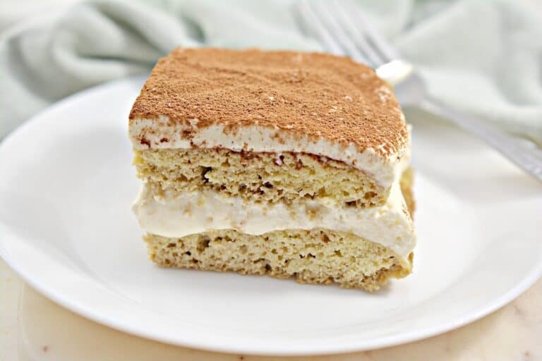 A slice of tiramisu cake on a plate.