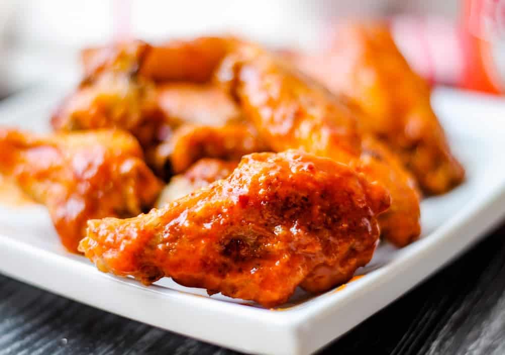 A plate of oven baked chicken wings.