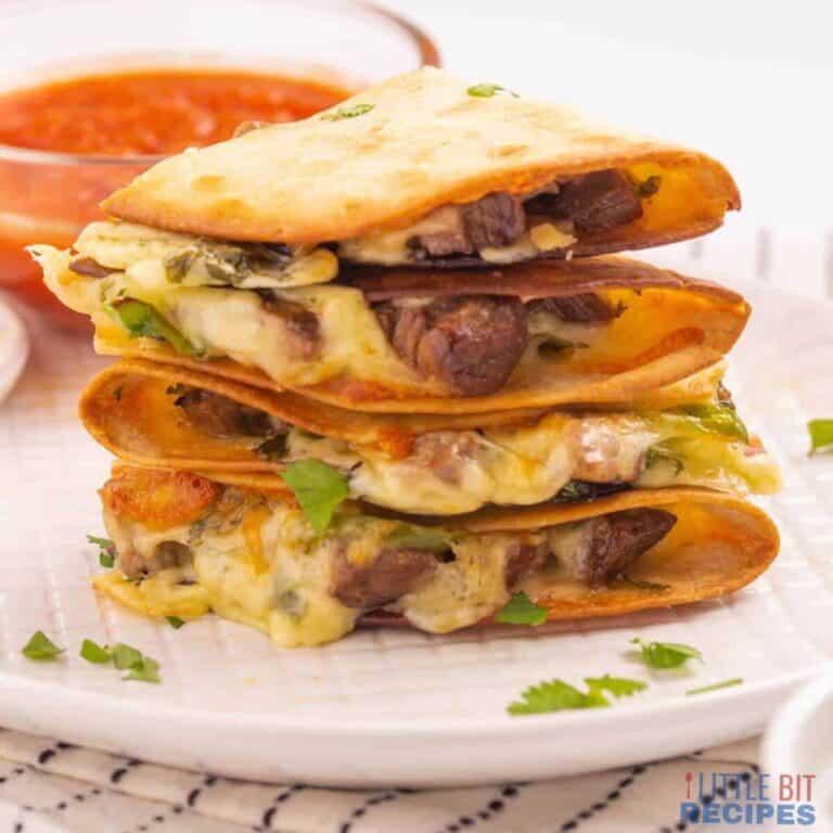 A stack of quesadillas on a plate.