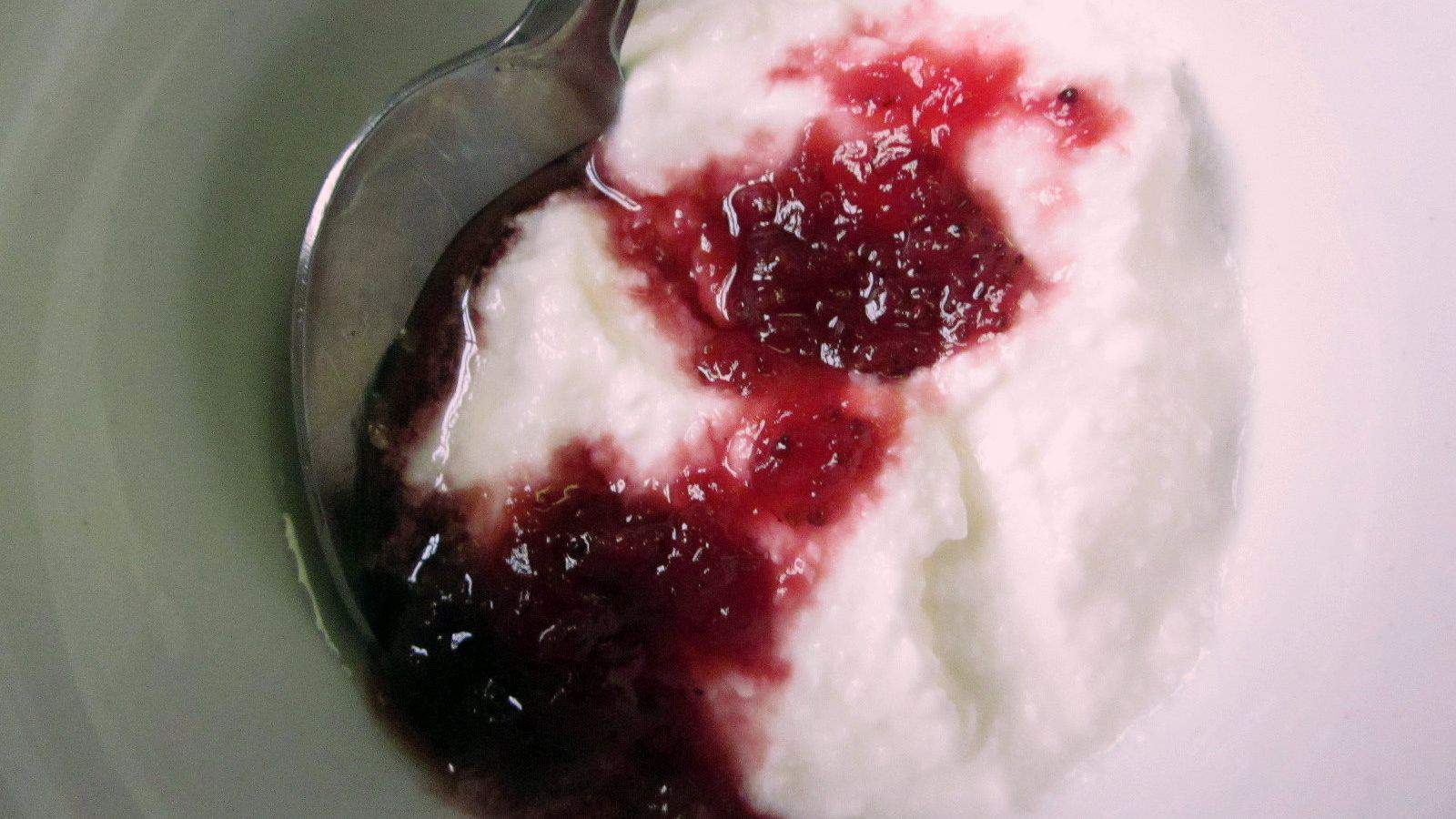 A spoonful of yogurt with a spoonful of cranberry sauce from one of the 17 Gut-Friendly Recipes.