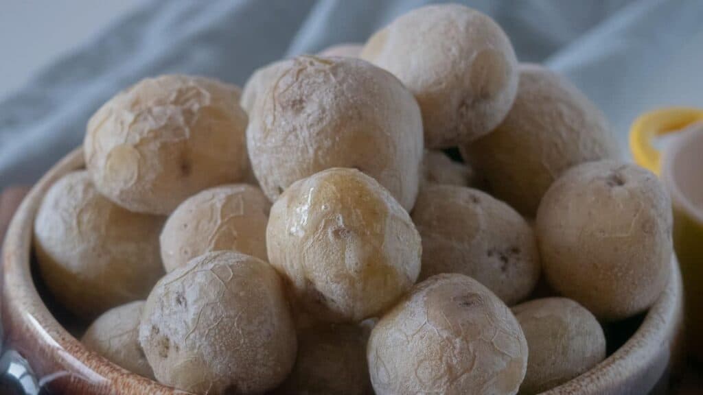 White potatoes in a bowl on a table.