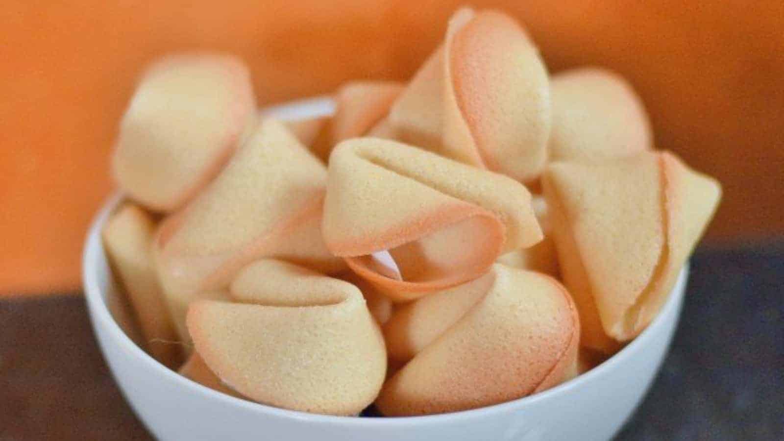 Image shows a Bowl filled with homemade fortune cookies.