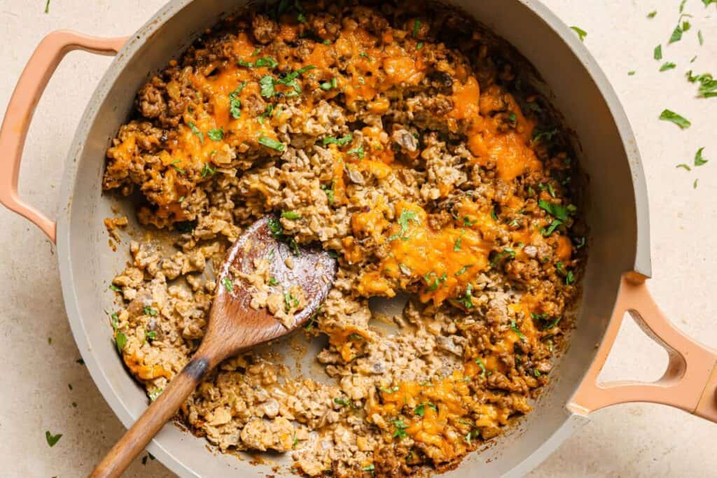 A casserole dish with meat and cheese in it.