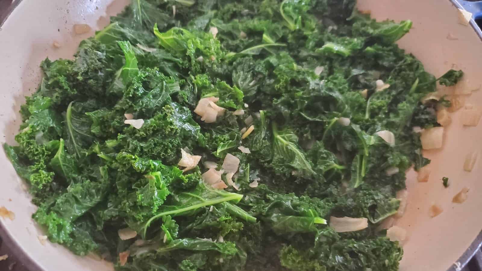 Garlic sesame kale in a pot just cooked and ready to eat.