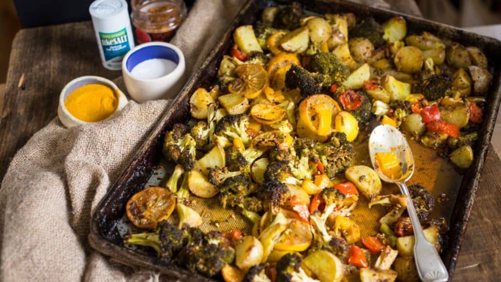 Roasted vegetables on a wooden table.