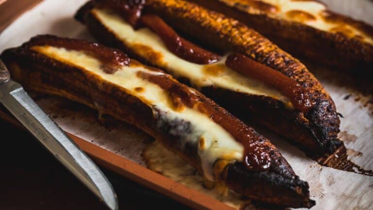 Food on a tray with a knife.