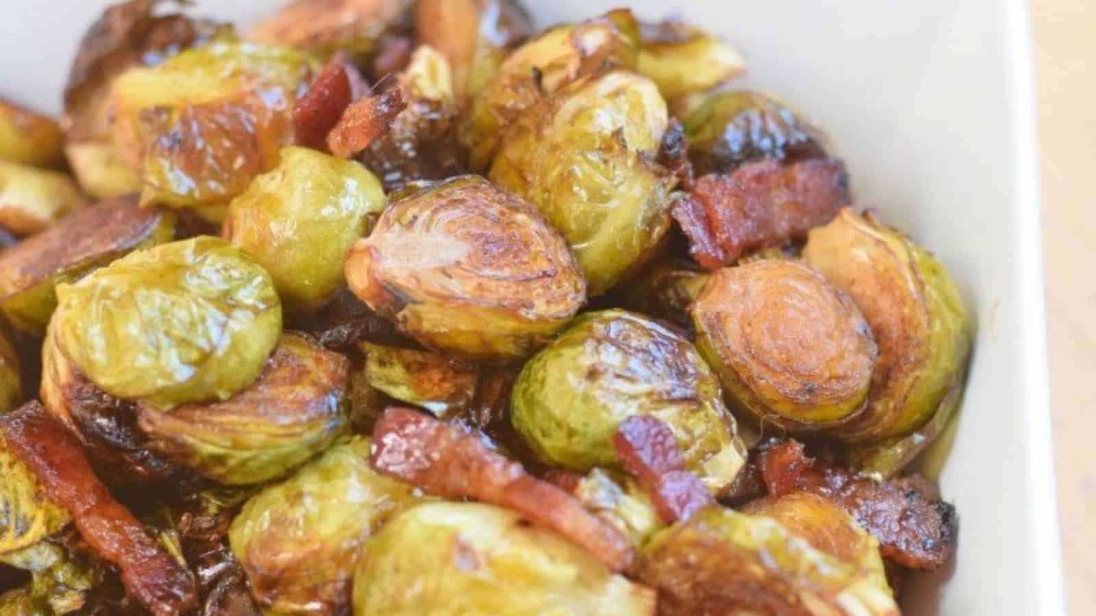 Roasted brussels sprouts with caramelized edges in a serving dish.
