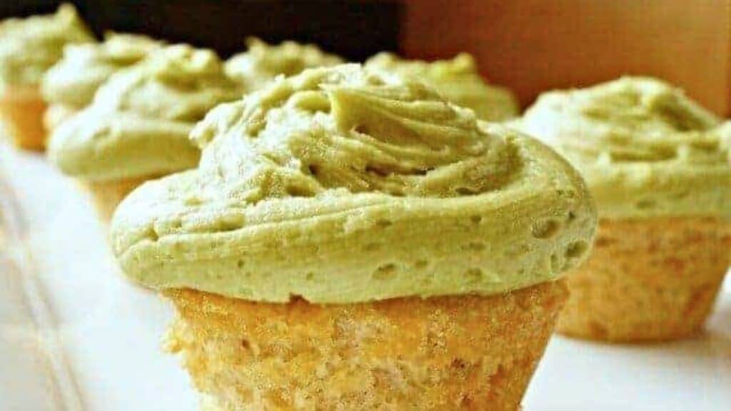 Image shows Cupcakes with matcha frosting on a white plate.