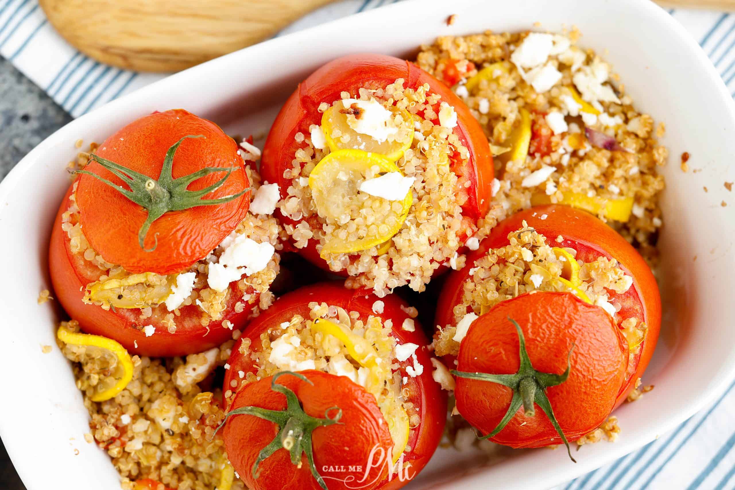 Flatlay of stuffed tomatoes with 'lids' on.