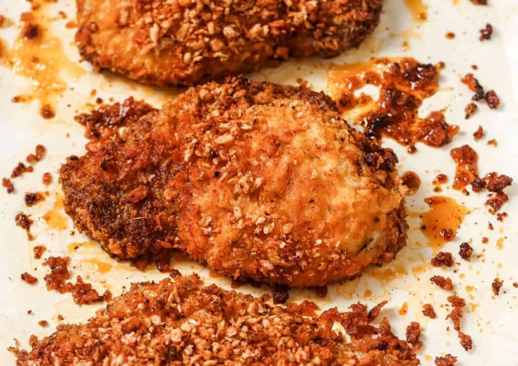 Shake and bake pork chops on a baking sheet.