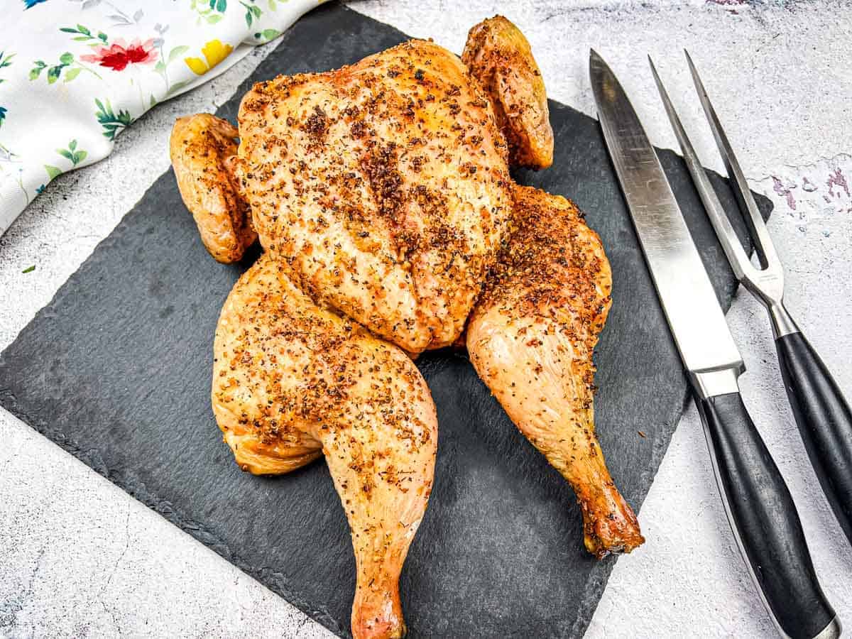 https://fooddrinklife.com/wp-content/uploads/2024/03/Traeger-Smoekd-Chicken-Spatchcock.jpg