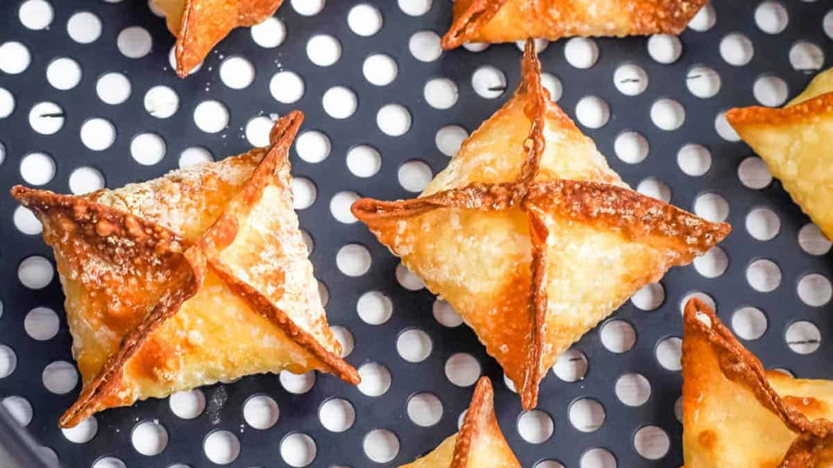 Crab rangoon in the air fryer basket.