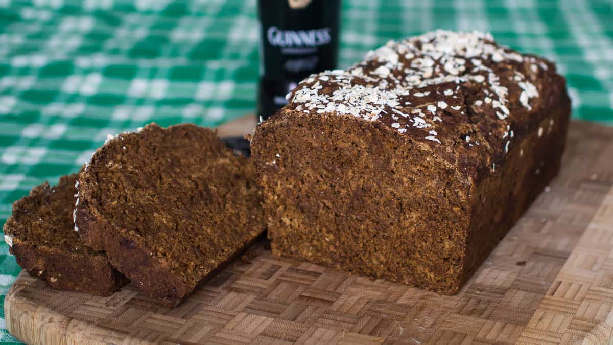 Sliced Guinness bread on a cutting board.