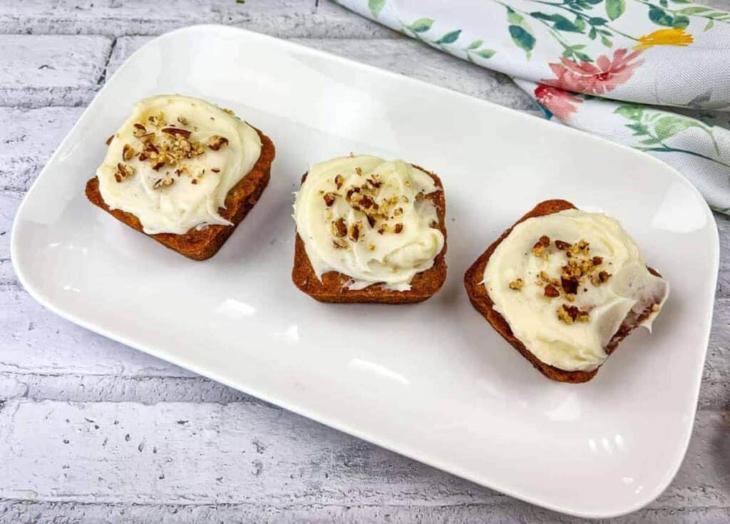 Three mini hummingbird cake on a white plate.