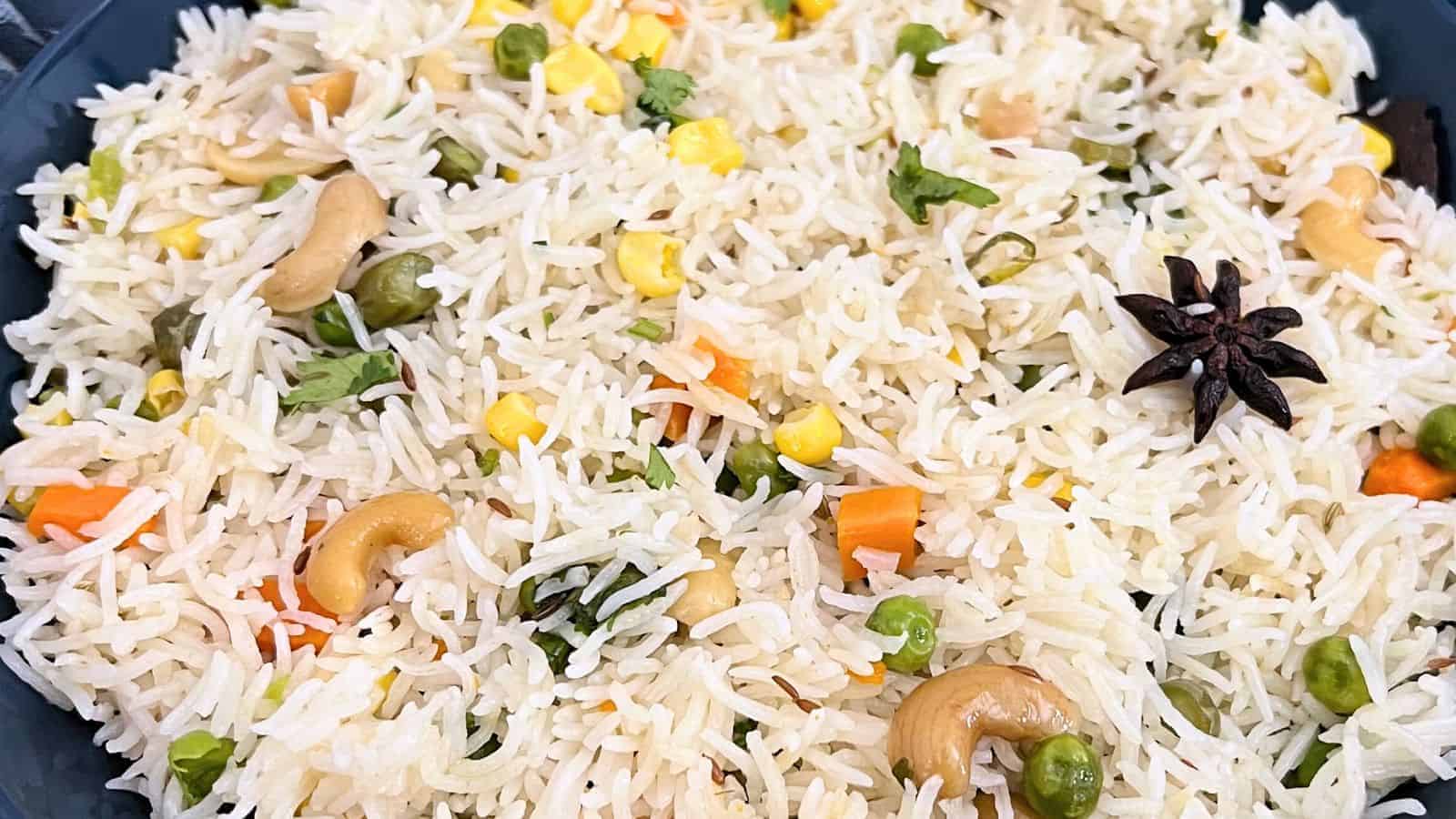 Close-up of Coconut Milk Pulao with cashews and spices.