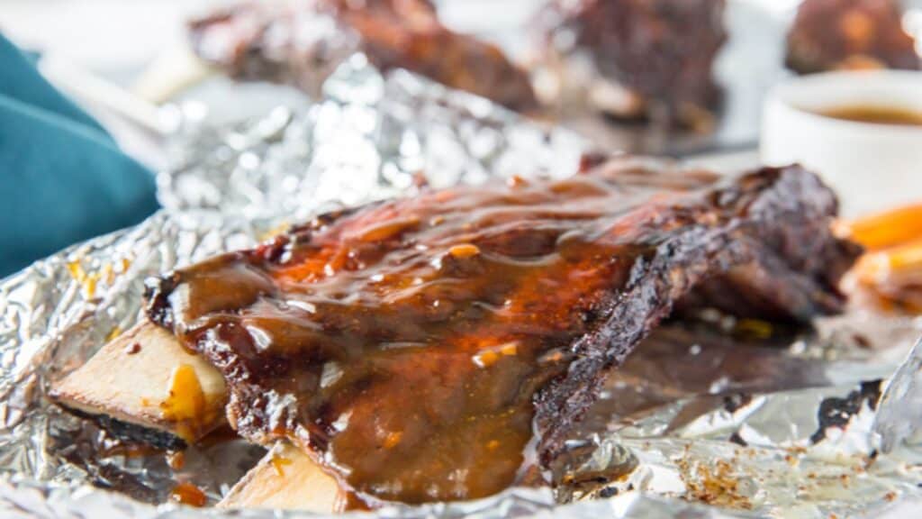 Instant pot ribs- fall off the bones beef ribs with extra sauce on the side.