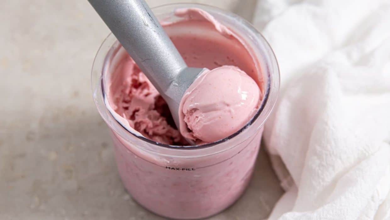 Ninja CREAMi Strawberry Ice Cream in a white bowl.