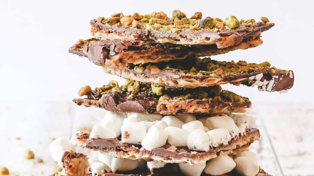 A stack of chocolate bark with marshmallows and pistachios.