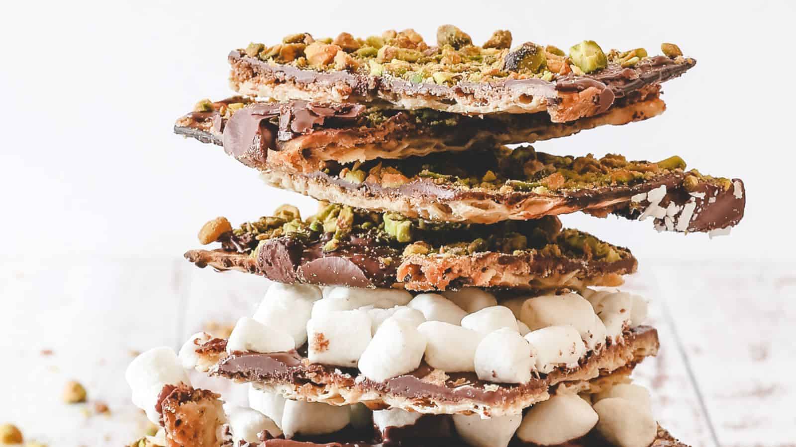 Close up on matzo crack with marshmallow and pistachio.