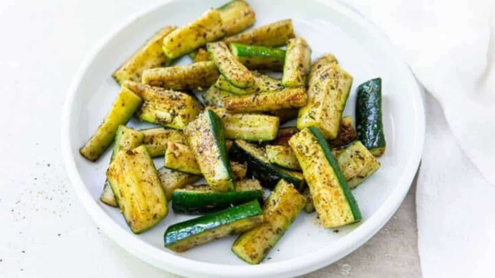 Zucchini on the Blackstone Griddle on a white plate.