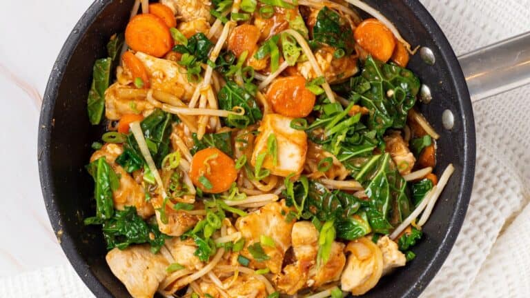 Stir-fried chicken chop suey in a skillet.