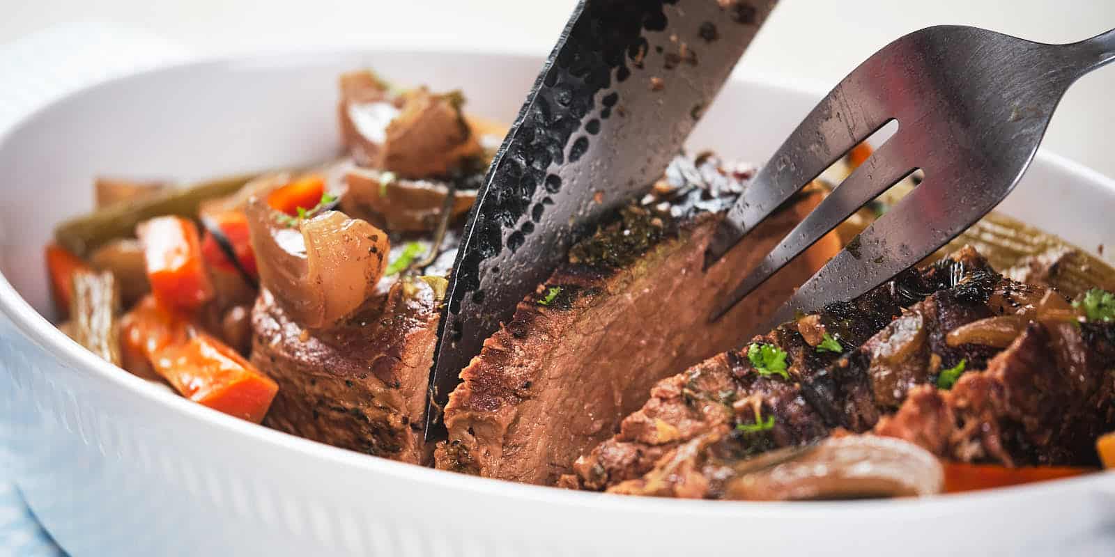 A picture of Slow Cooker Pot Roast with carrot and parsnip.