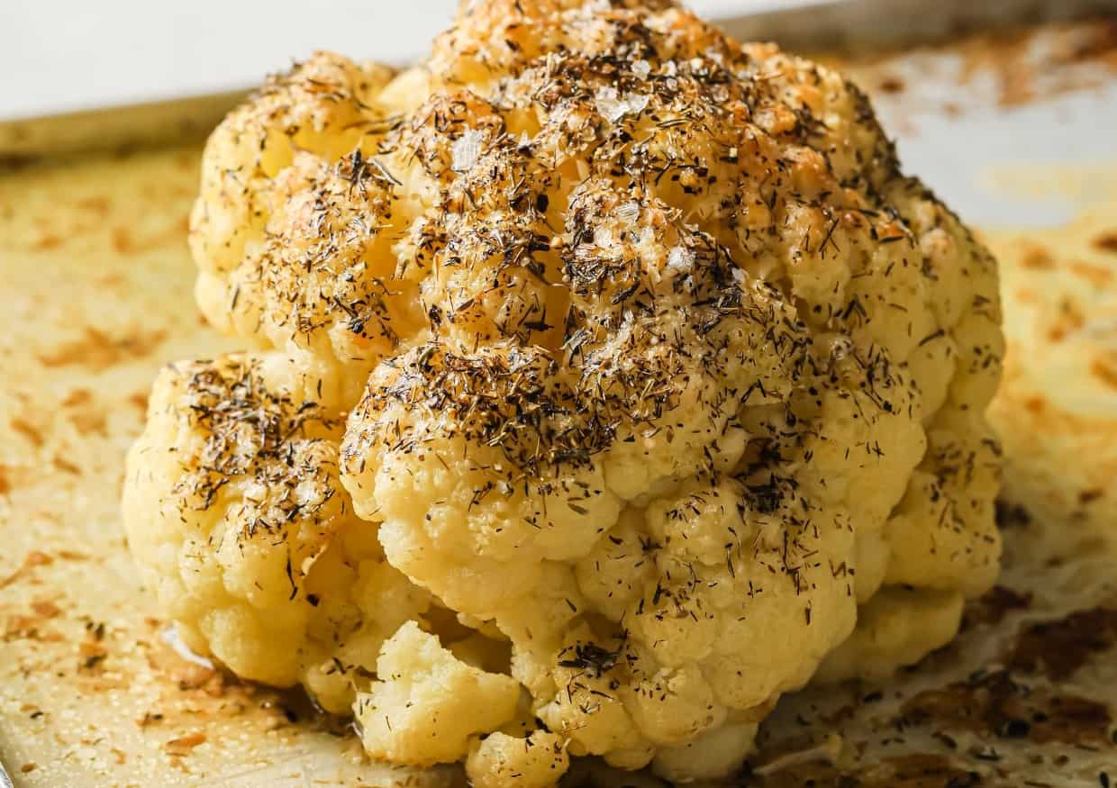 https://tastesdelicious.com/wp-content/uploads/2024/06/Buttery-Whole-Roasted-Cauliflower-1.jpg