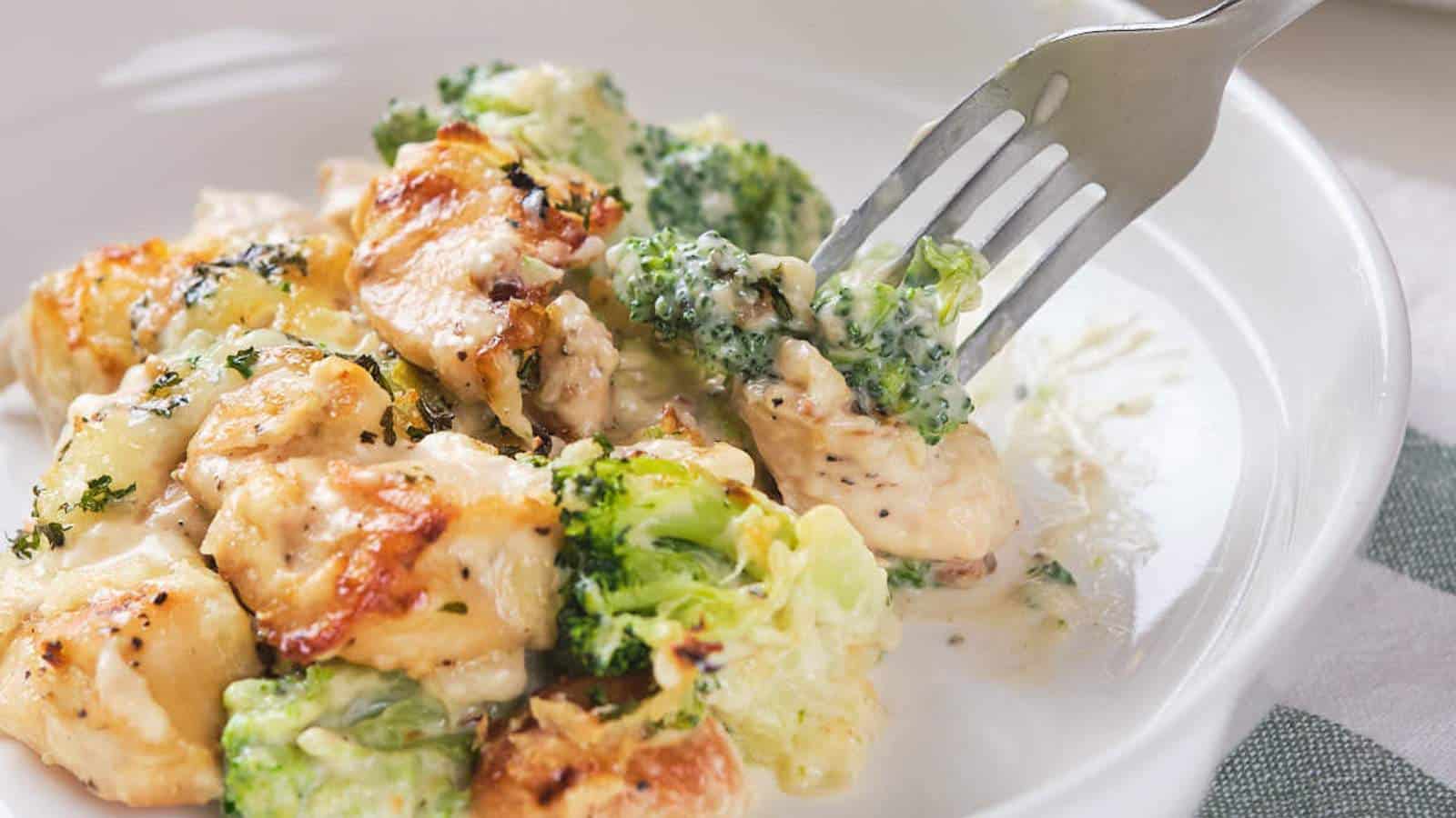 Chicken alfredo broccoli bake cooking in dish on rack.